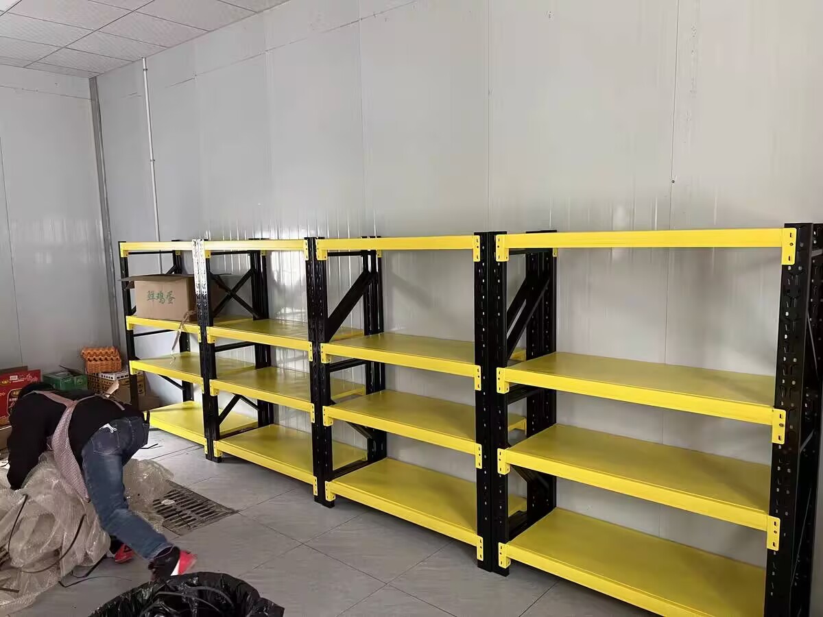 Heavy-Duty Pallet Racking - Industrial Warehouse Storage Shelves Heavy duty warehouse pallet racking system with yellow beams, industrial steel storage shelves for bulk goods